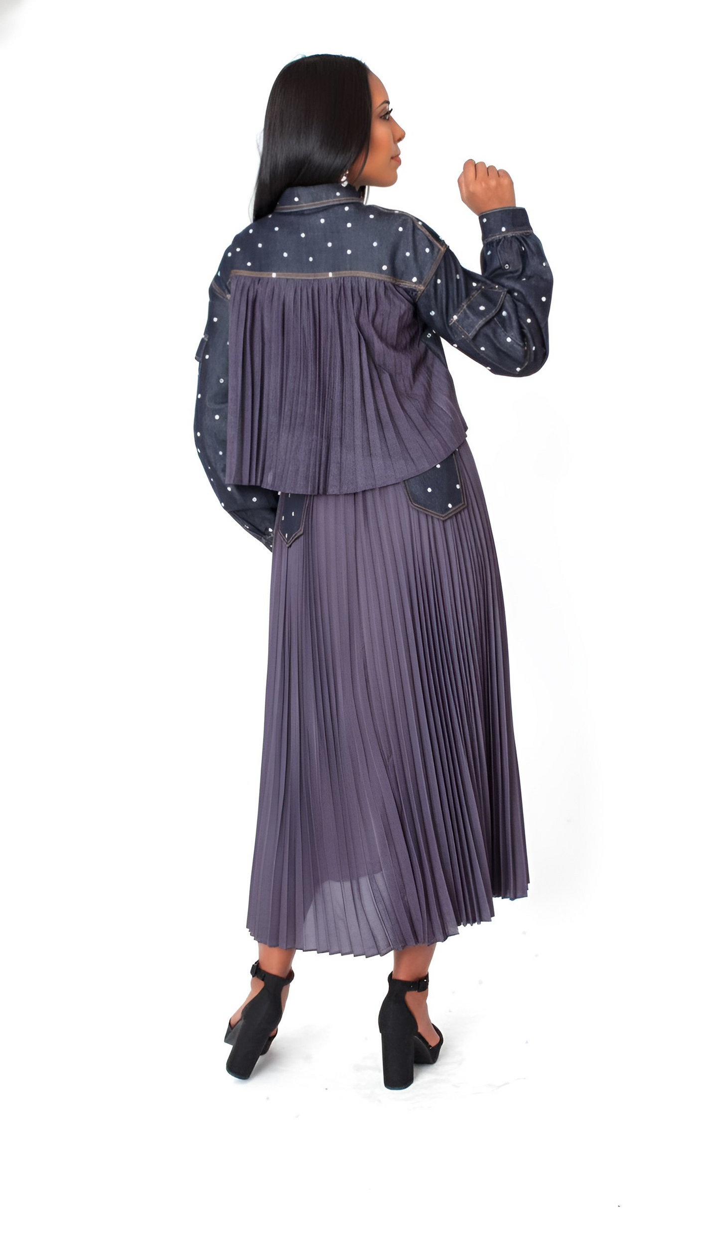 Midnight stud denim set featuring pearl stud embellishments and pleated back detail, model showing back view of jacket and skirt For Her NYC