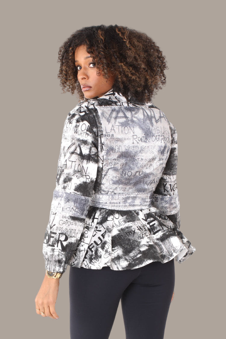Three quarter view printed peplum jacket showcasing peplum silhouette and graphic print — For Her NYC