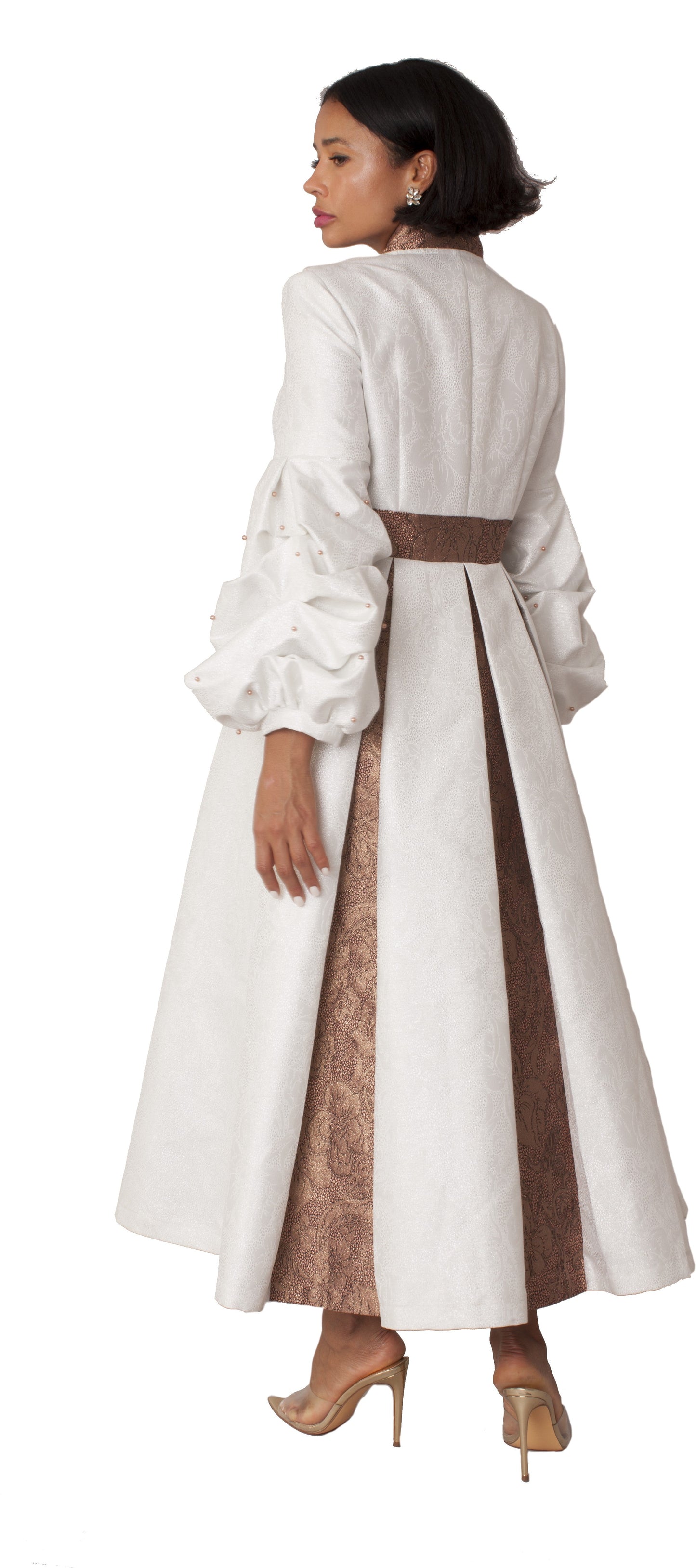 White formal dress robe with puff sleeves and pearl cross accent, back view showcasing elegant drape and ceremonial styling by Tally Taylor
