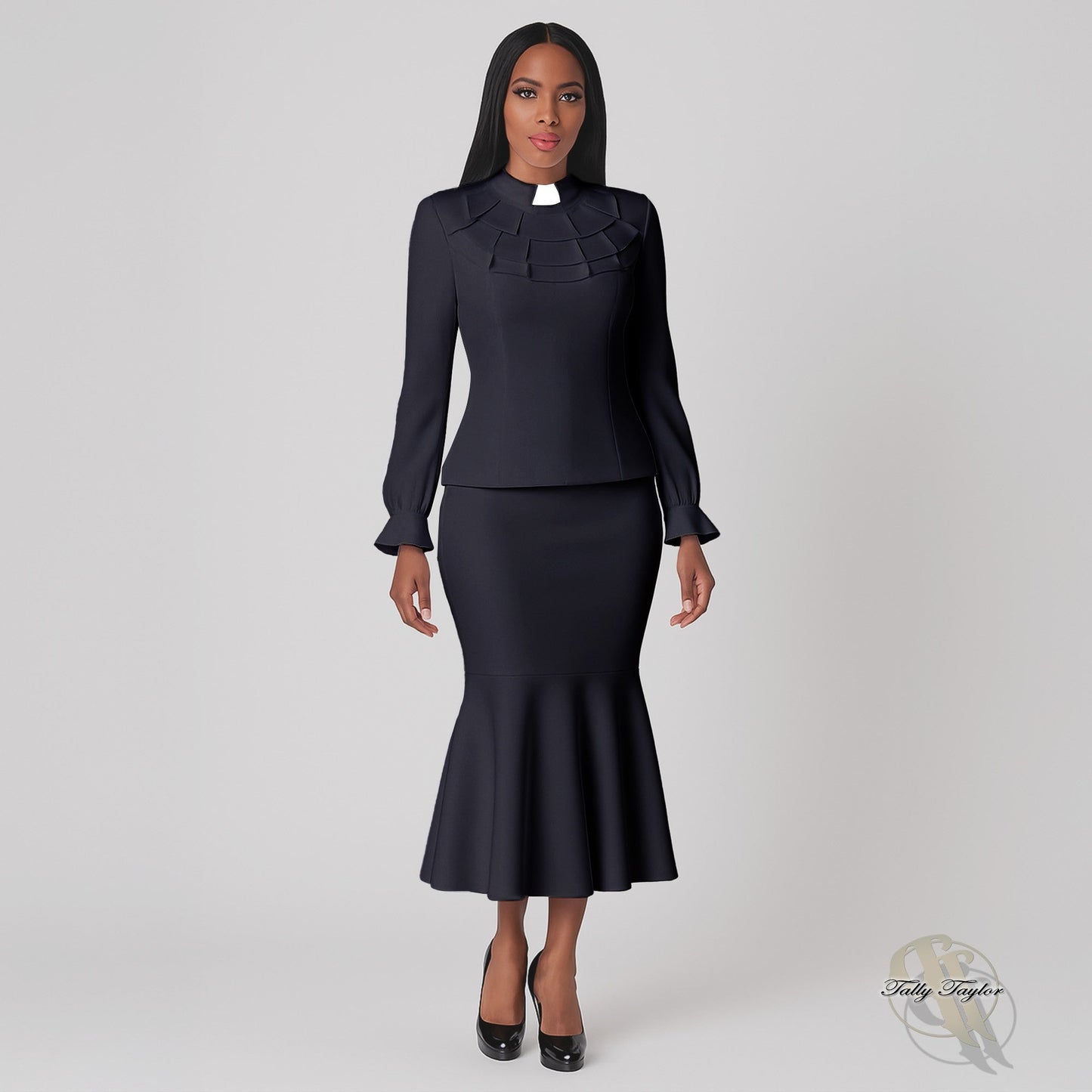 Model wearing black and white plus size two-piece ruffle church set, front standing pose by Tally Taylor