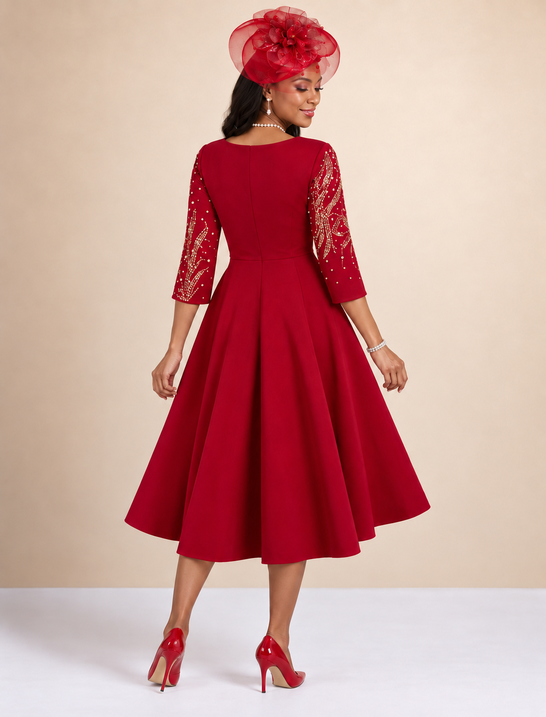 Back view of a model wearing the Tally Taylor Elegant Sequin A-Line Dress – U0261 in red with gold sequin detailing on the three-quarter sleeves