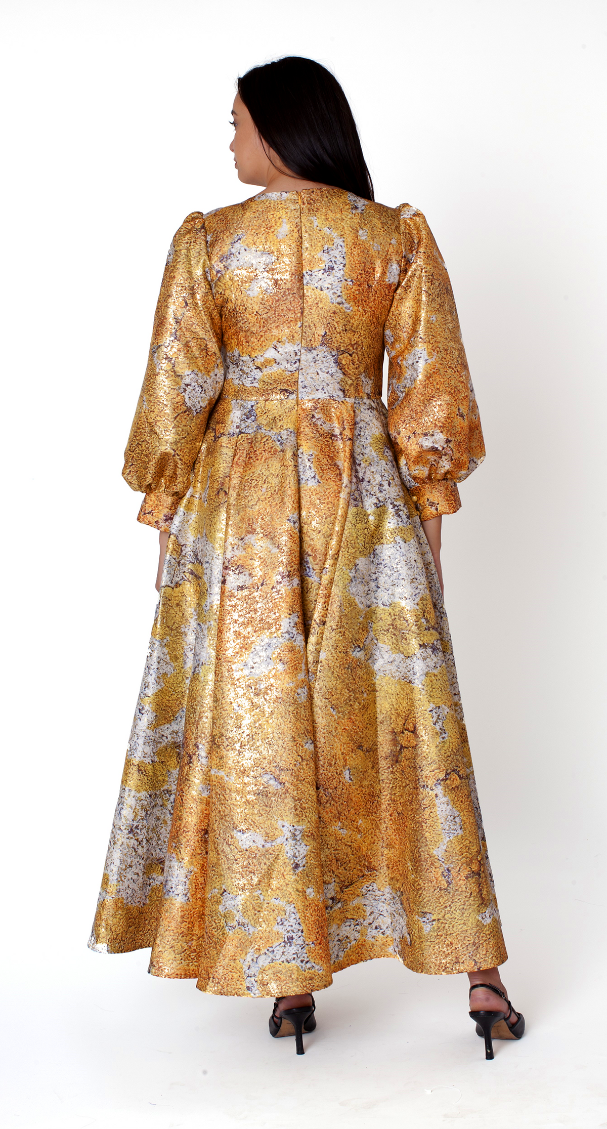 Back view of the Tally Taylor yellow multi floral brocade maxi dress featuring bishop sleeves and a flowing silhouette.
