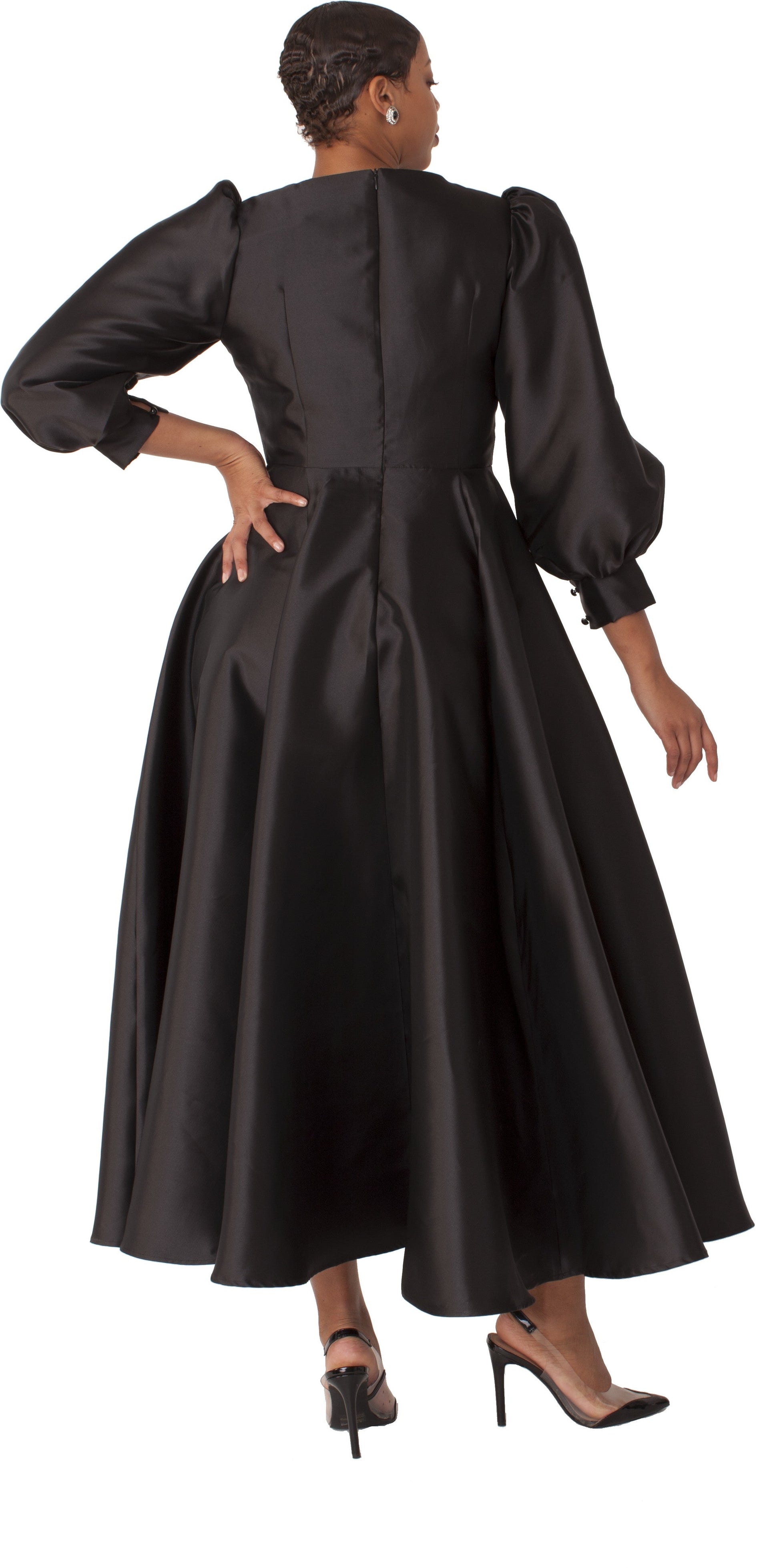 Black elegant long dress with bishop sleeves hand on hip pose Tally Taylor