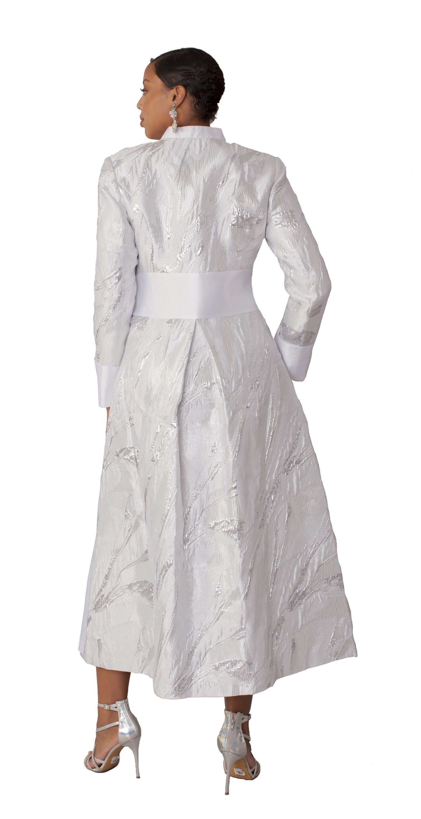 White and silver brocade clergy robe with cross brooch back pose Tally Taylor