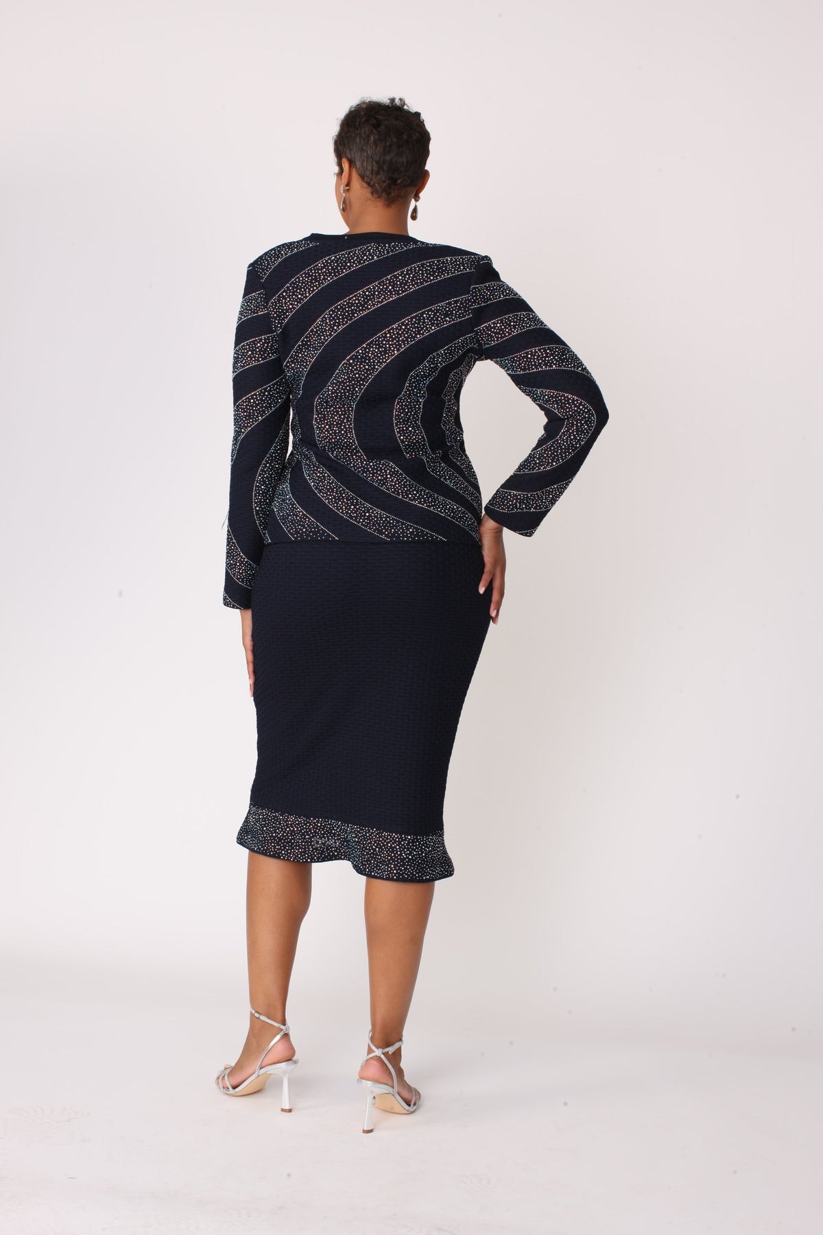 Back view of navy and silver starburst skirt suit with beaded jacket detailing, Tally Taylor