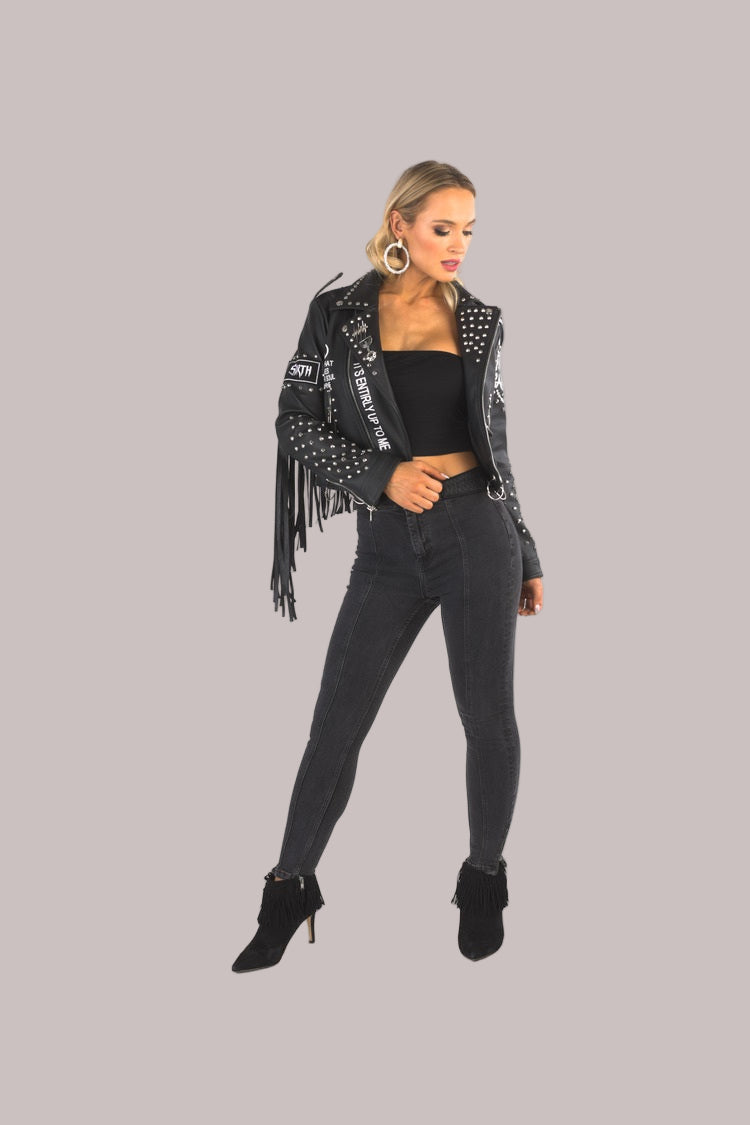Black fringe faux leather studded moto jacket front view on model – For Her NYC