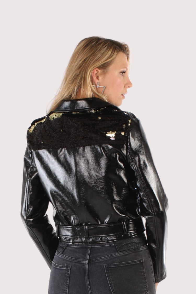 Back view of black faux leather moto jacket with sequin panel accent for edgy street style. For Her NYC