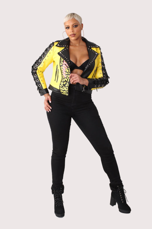 Yellow and black faux leather graffiti jacket featuring lace-up sleeves and stud detailing, front view, For Her NYC