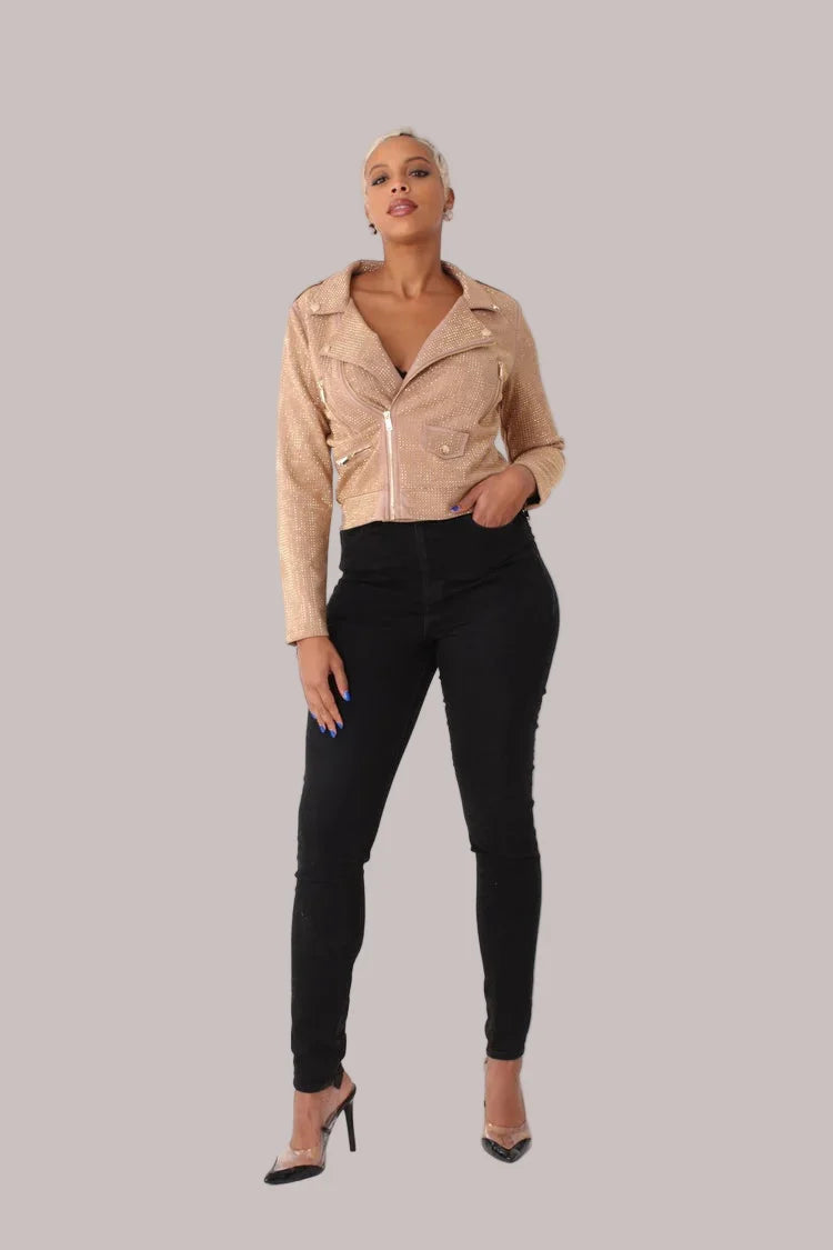 Nude faux suede moto jacket with allover diamond embellishments style 82022 shown in a side standing pose highlighting the cropped moto cut by For Her NYC