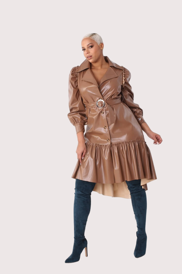 Model posing with hands on hips in the Leather High-Low Ruffle Midi Dress, emphasizing the waist tie and bold silhouette – For Her NYC