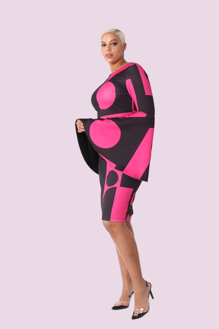 Color block bell sleeve dress style 82062 in black/pink shown in a full-body standing pose highlighting the statement silhouette by For Her NYC