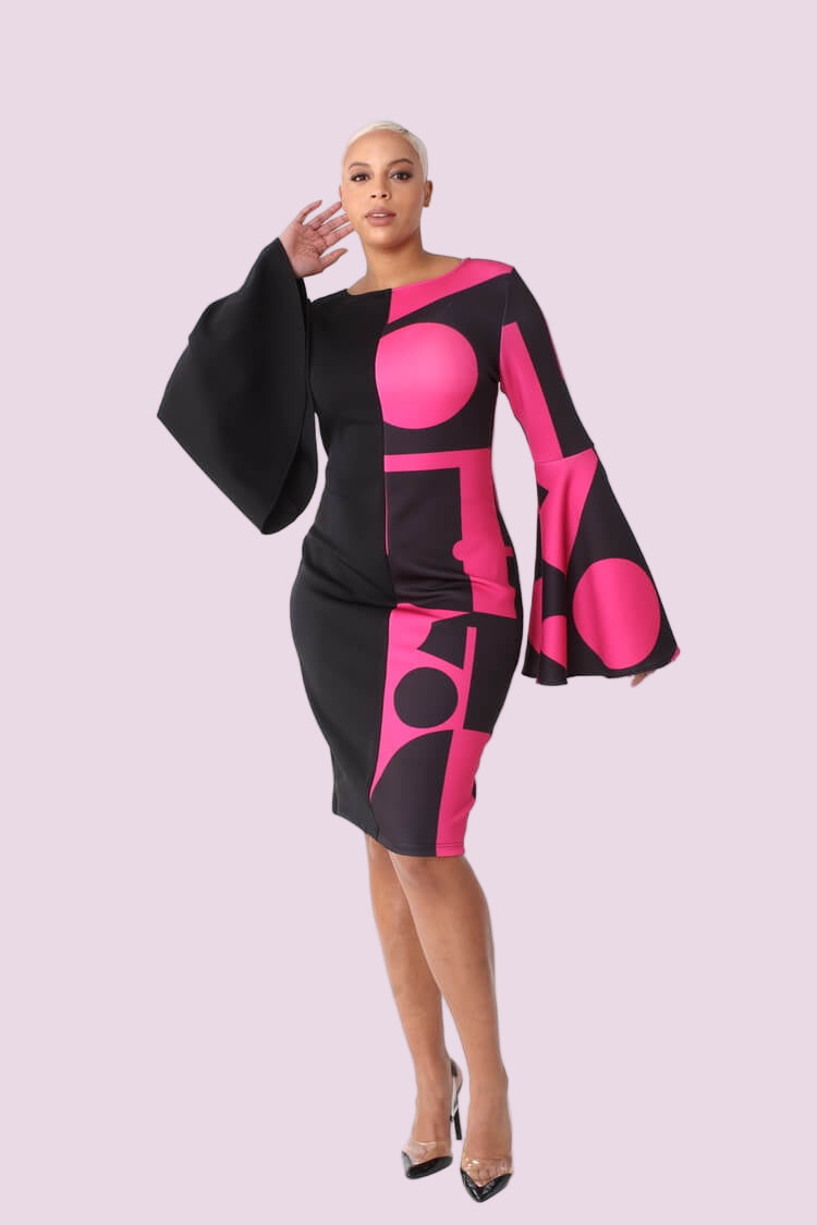 Color block bell sleeve dress style 82062 in black/pink shown in a walking forward pose emphasizing sleeve movement and contrast by For Her NYC