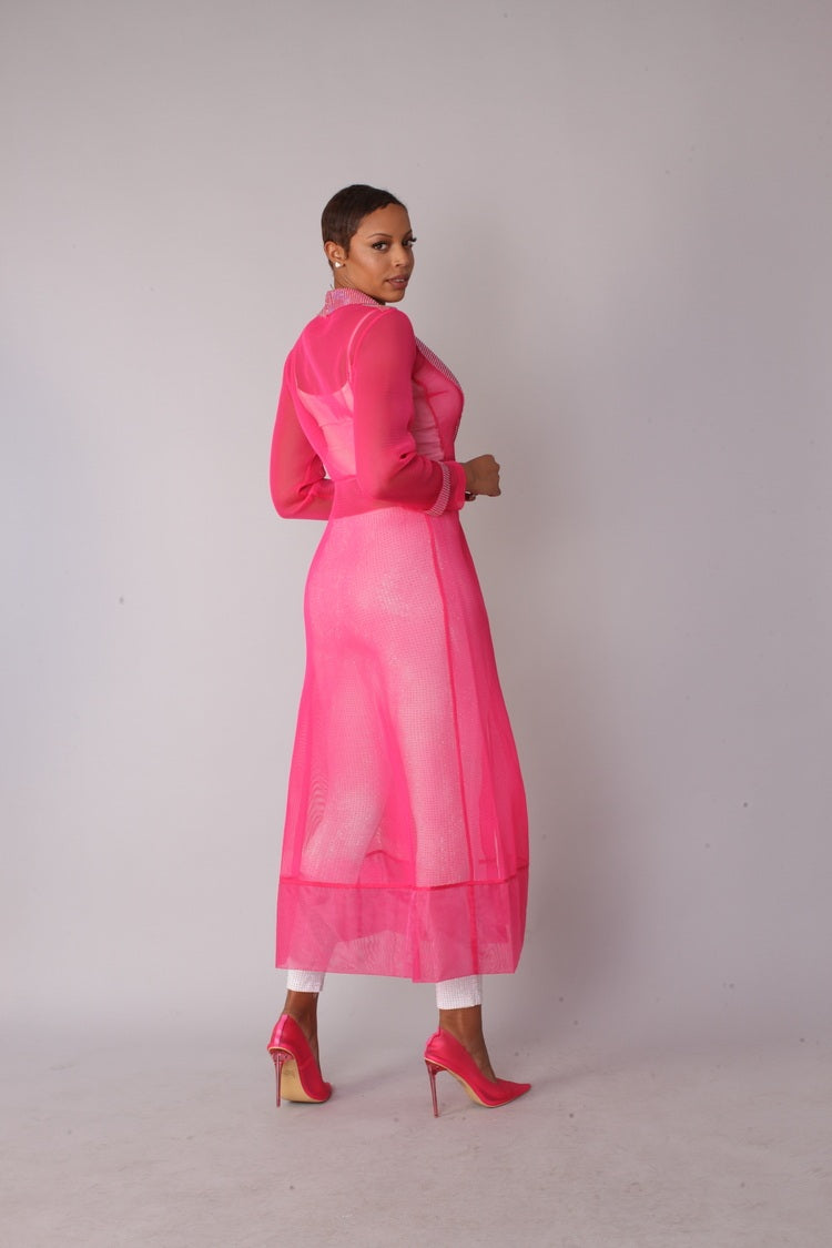 Pink rhinestone mesh duster jacket style 82213 shown in a walking forward pose emphasizing movement, flow, and dramatic sheer silhouette by For Her NYC