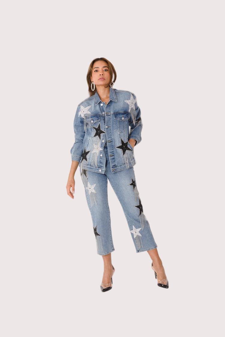 Stardust Dreams denim jacket style 82331 shown from the front in a fashion pose highlighting the embellished details and modern denim jacket design by For Her NYC