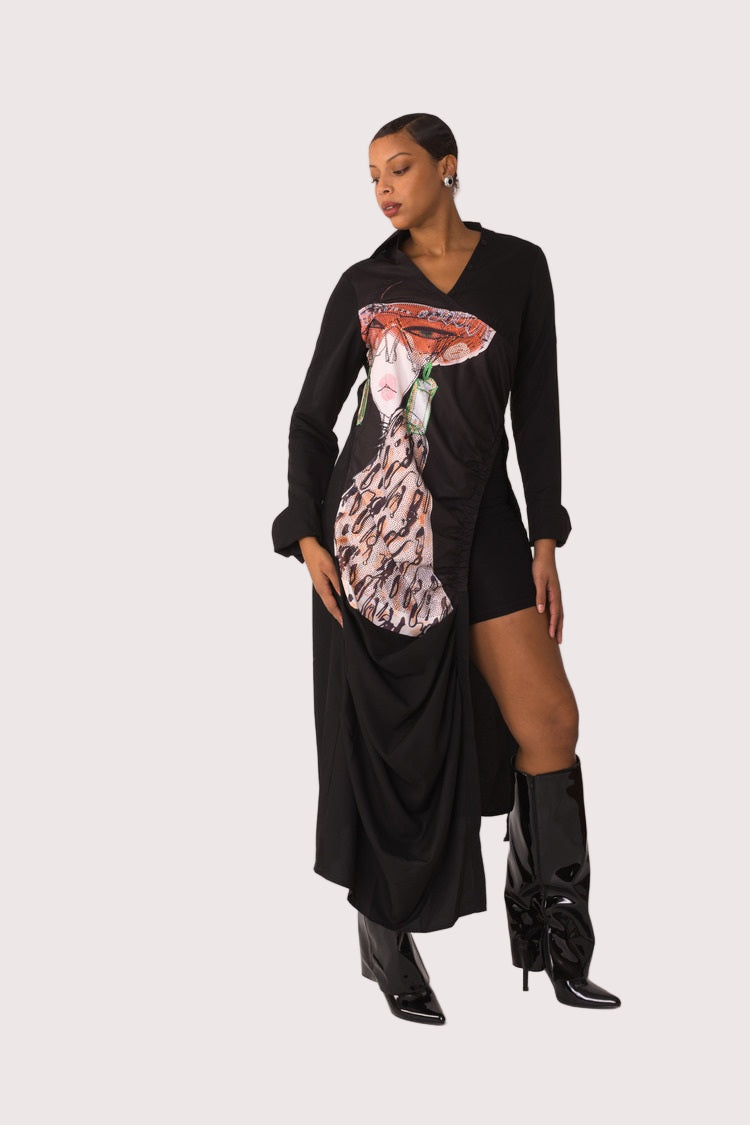 Champagne Dreams maxi dress style 82336 in black multi shown at a slight side angle emphasizing the asymmetrical drape and graphic detailing by For Her NYC