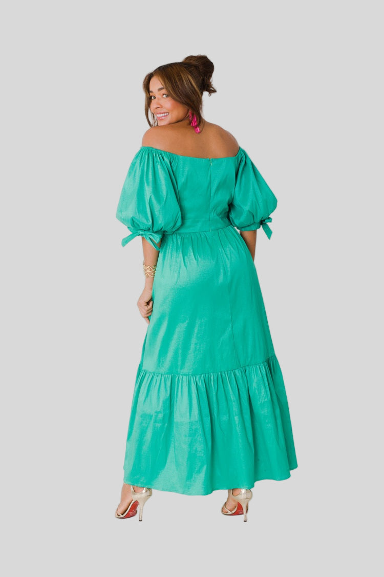 Sage Garden Party maxi dress style 82358 in emerald shown from the back in a standing pose showcasing the drape, sleeve volume, and overall fit by For Her NYC