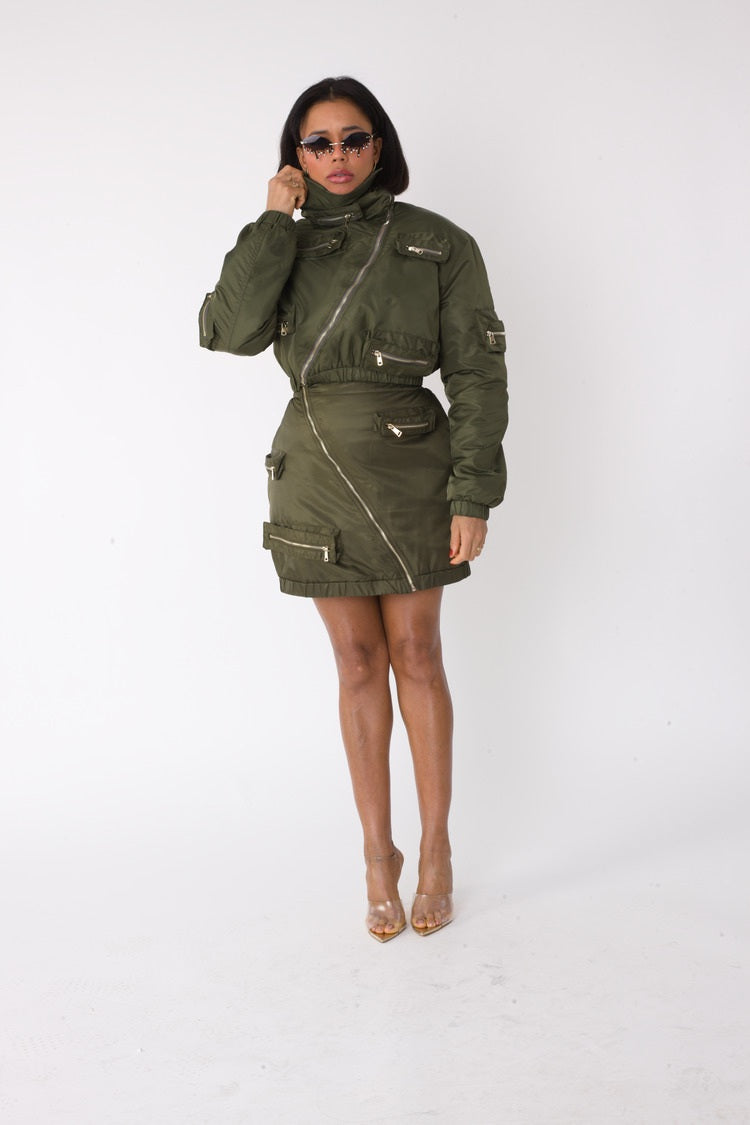 Model wearing olive cropped utility bomber jacket, front standing pose, For Her NYC