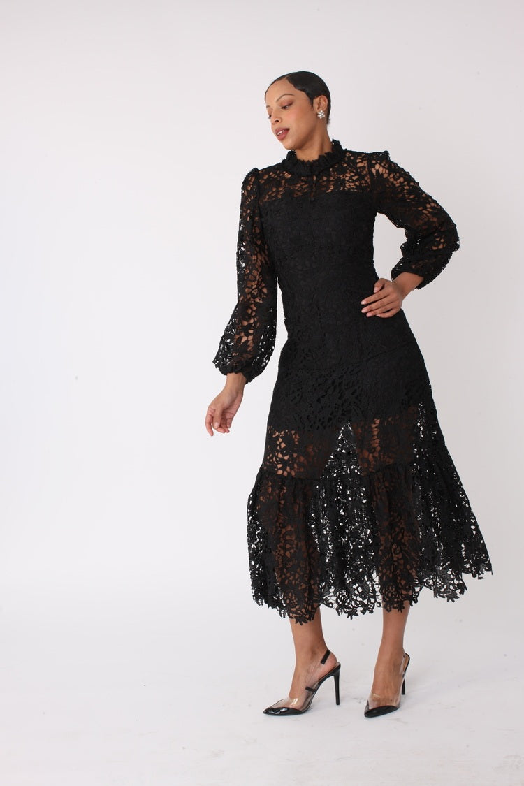Side view of black lace midi dress with long sleeves and scalloped hem, For Her NYC
