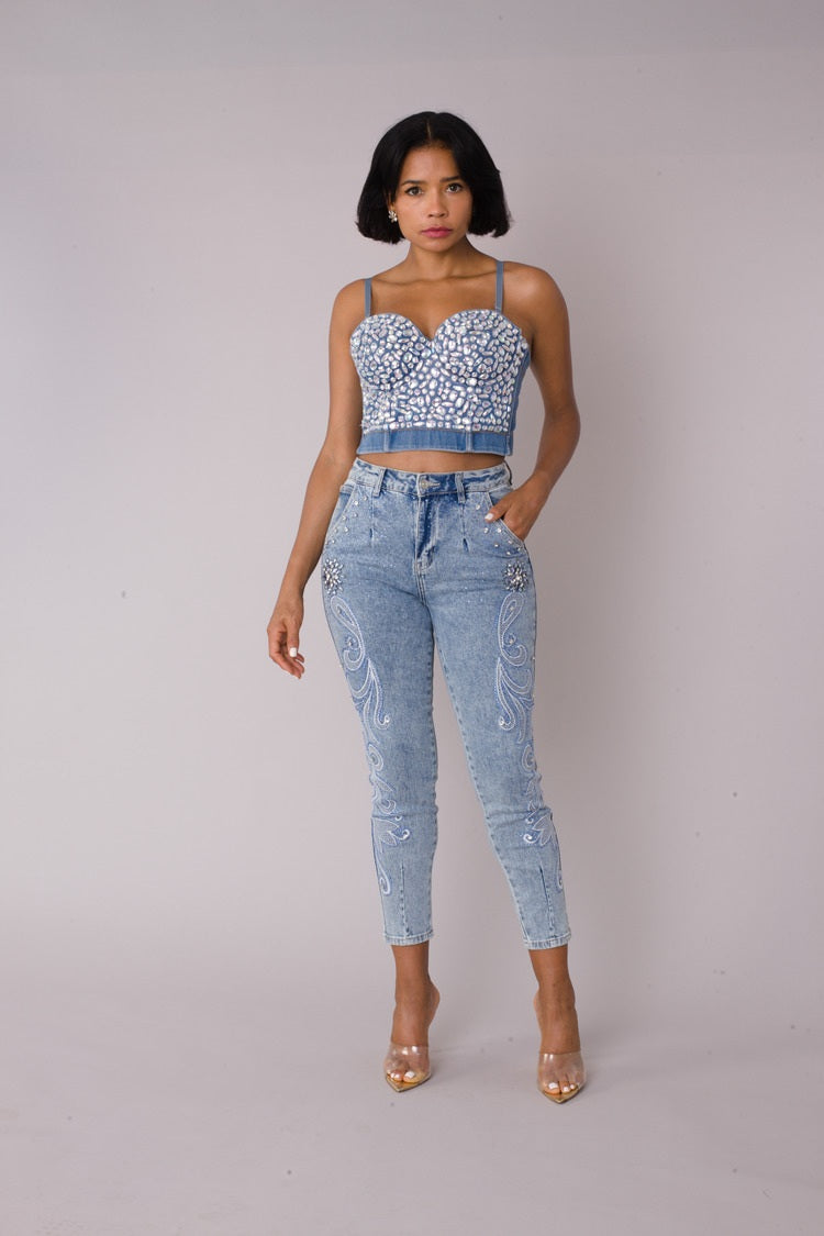 Model wearing embroidered capri denim jeans in light wash denim, front standing pose, For Her NYC
