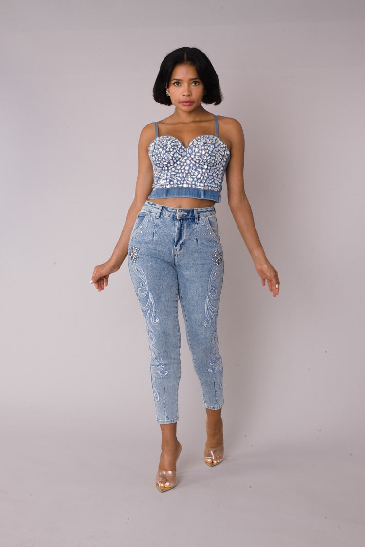 Model wearing embroidered capri denim jeans with silver embroidery and crystal embellishments, front walking pose, For Her NYC