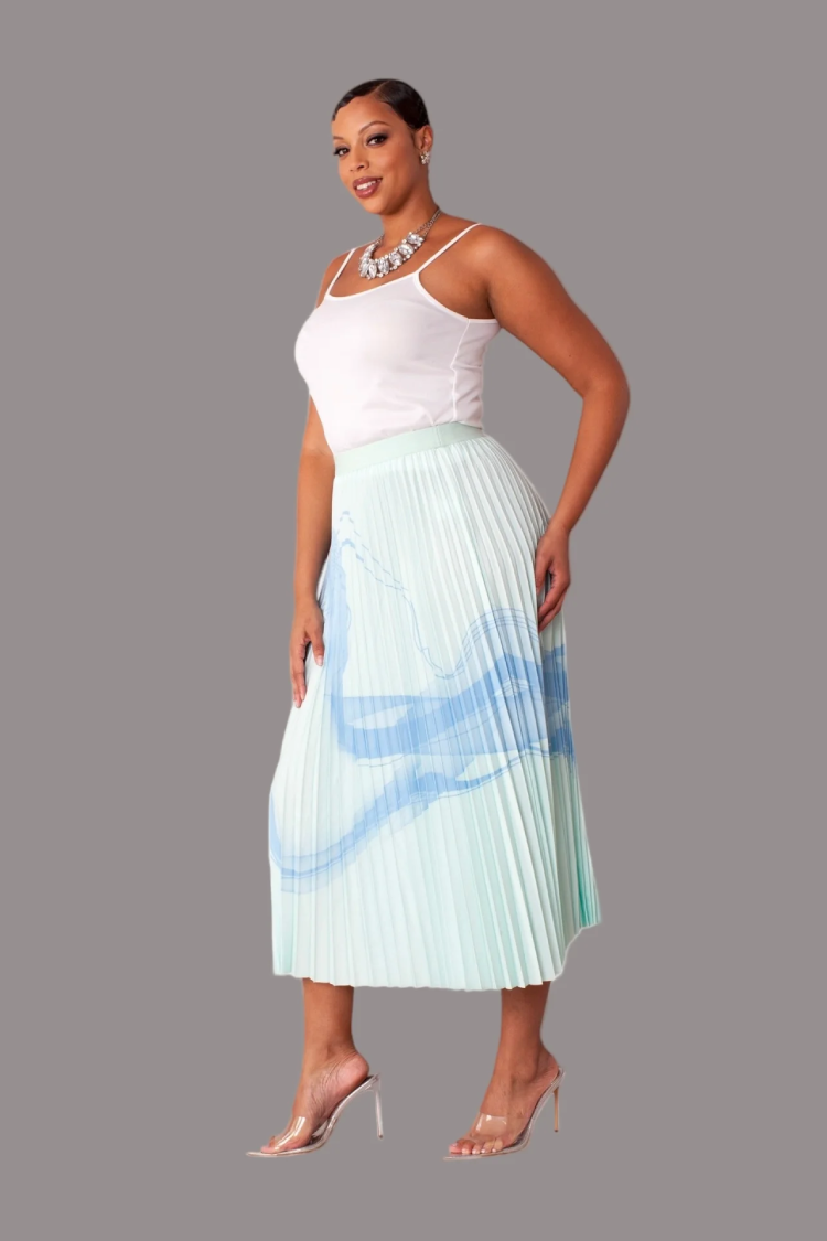 Watercolor print pleated maxi skirt in green multi, model standing front view, For Her NYC