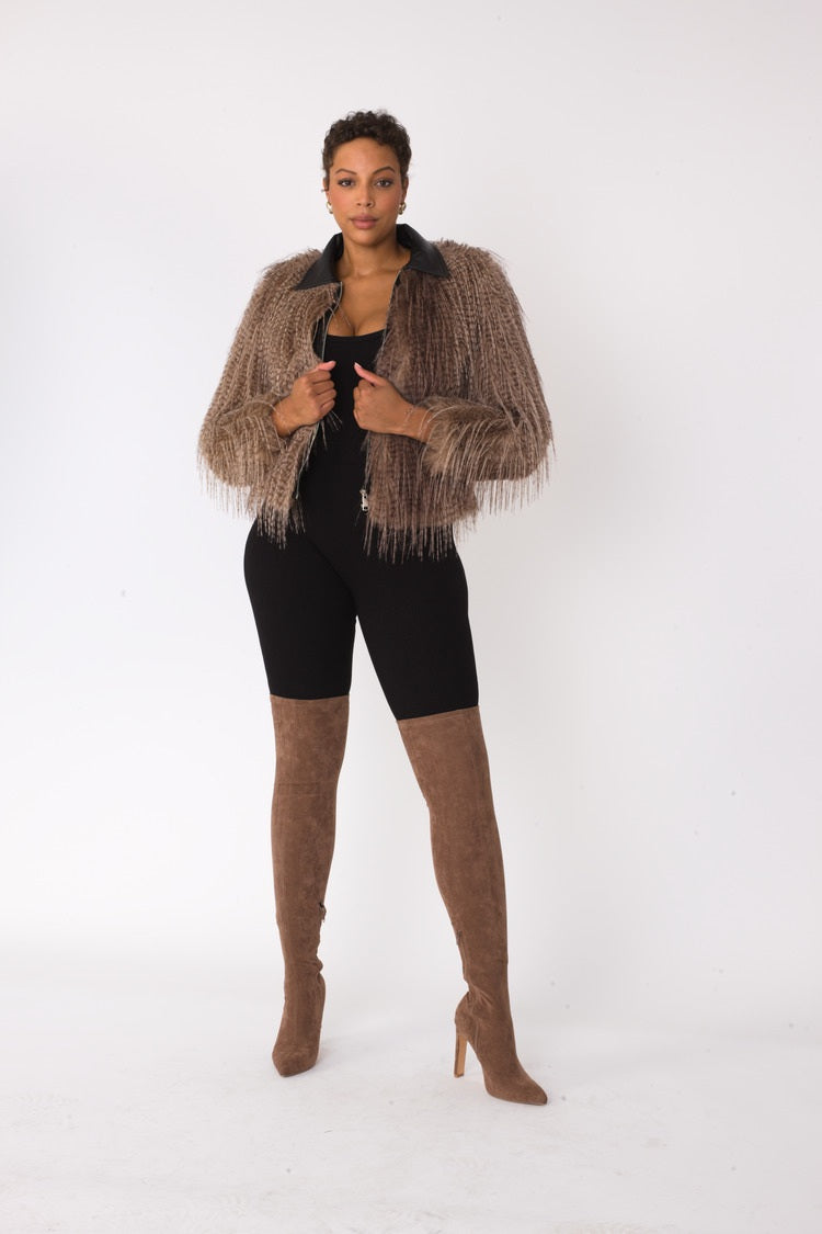 Beige and black shaggy faux fur bomber jacket shown in front standing pose with sleek bomber fit and long-hair texture by For Her NYC