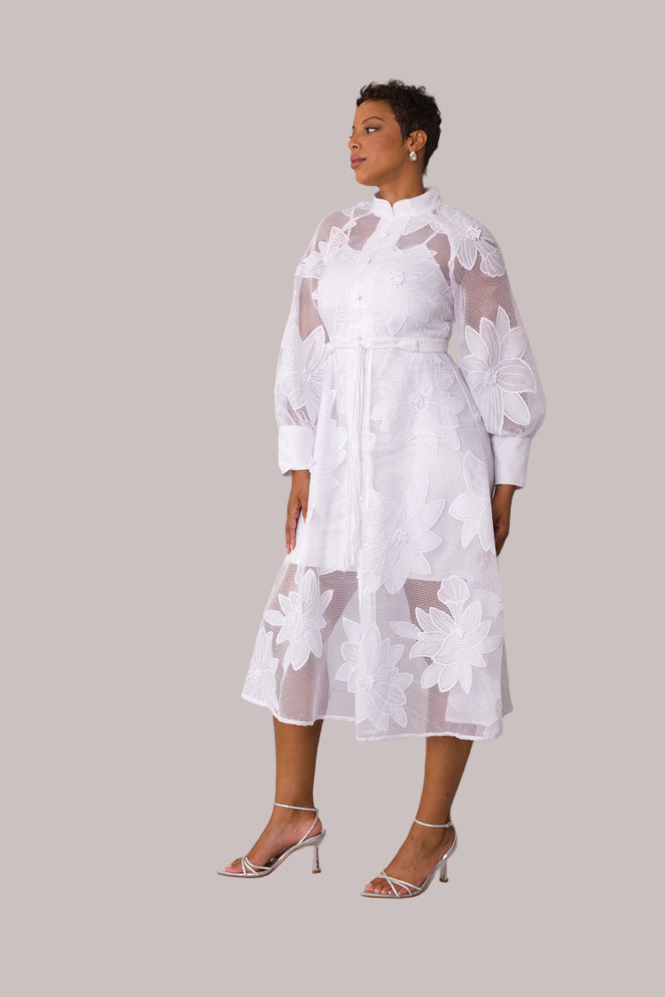 White floral mesh two-piece dress set shown in front walking pose highlighting flowy hem by For Her NYC