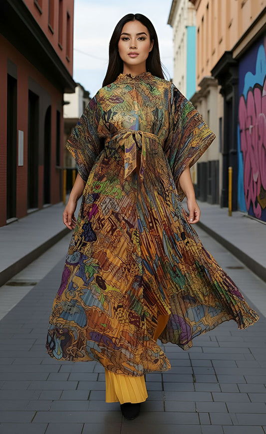 82930 mustard/multi Model wearing Pleated Pantset with abstract print and golden pleated pants, styled in an urban street setting by For Her NYC.