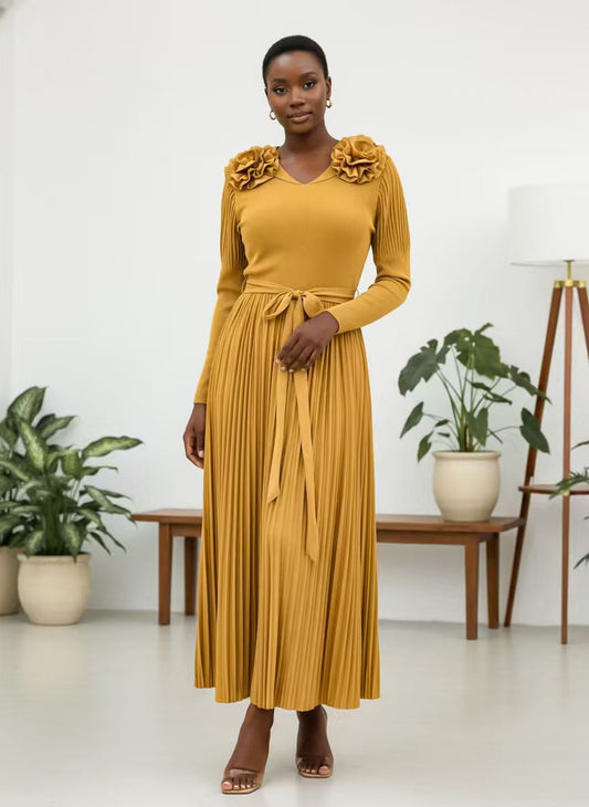 Yellow pleated maxi dress with long sleeves, floral shoulder accents, V-neckline, tie waist, and flowing skirt For Her NYC 83003