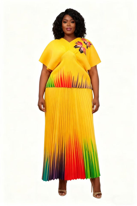 83016-yellow multi Front view of model wearing a gradient pleated skirt set with relaxed top and flowing midi skirt, For Her NYC