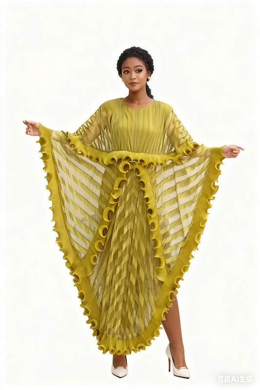 Model wearing a yellow pleated maxi dress with cascading ruffles and sheer striped sleeves, front view – For Her NYC 83024