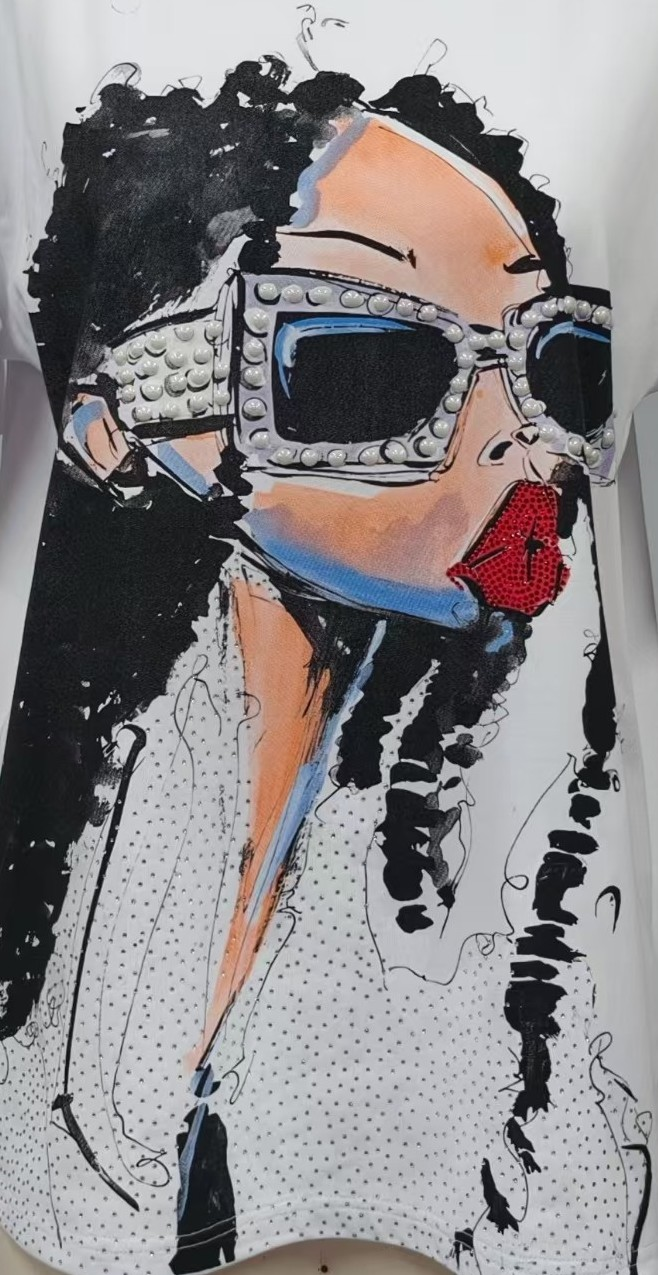 Close-up artwork detail of a white graphic tee featuring pearl studded sunglasses, rhinestone lip accents, and illustrated fashion face design – For Her NYC