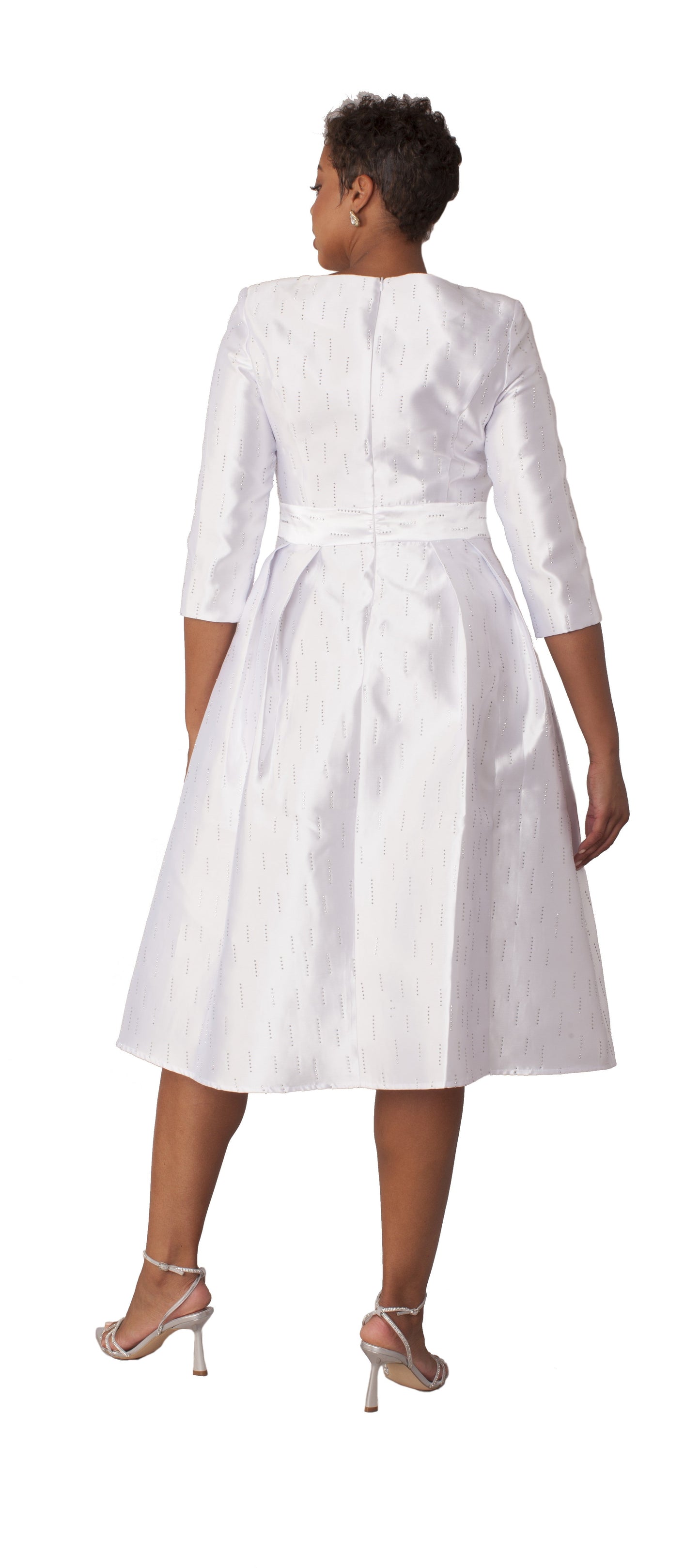 Back view of white shimmer A-line tea length dress with three-quarter sleeves, fitted waist, and pleated skirt by Tally Taylor