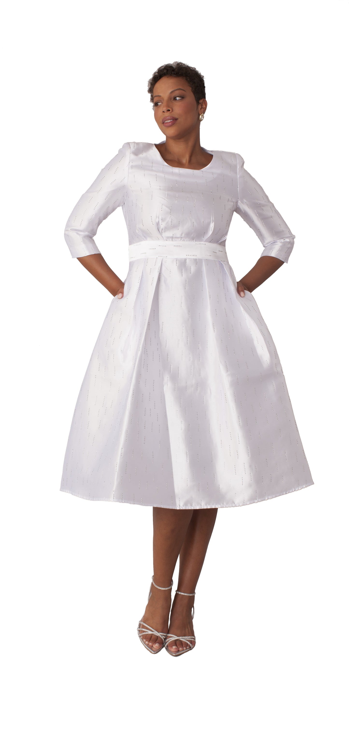 White shimmer A-line tea length dress with fitted bodice and pleated skirt shown from the front by Tally Taylor