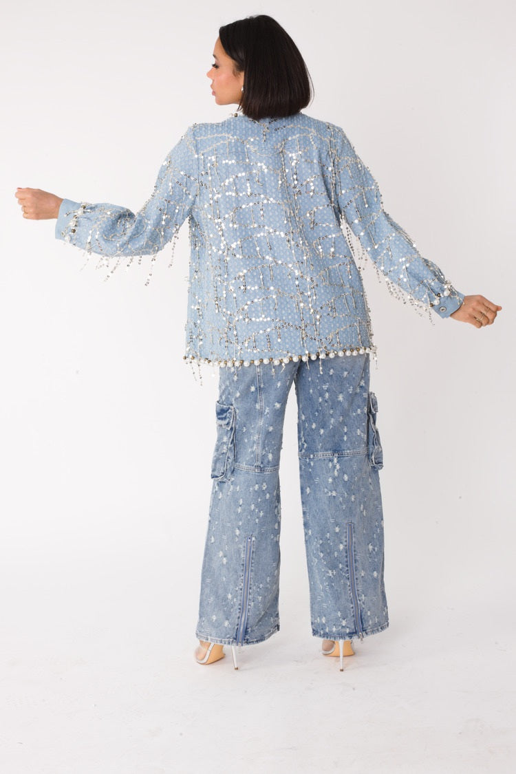 Blue denim jacket with sequins and pearl embellishments shown from the back, full outfit view, For Her NYC