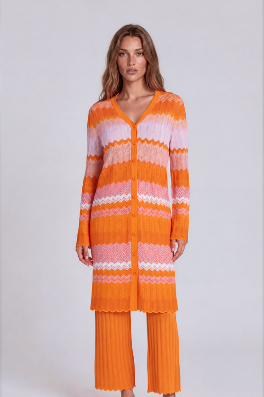 Orange multi chevron knit dress and pant set 51013 front view with model standing angled, button-front long sleeve knit dress layered over matching pants – Tally Taylor