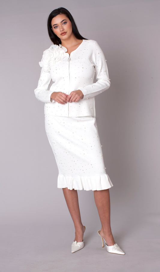 Woman wearing a white two-piece skirt suit with bold 3D floral appliqué shoulder and midi skirt with flounce hem, front view — Tally Taylor