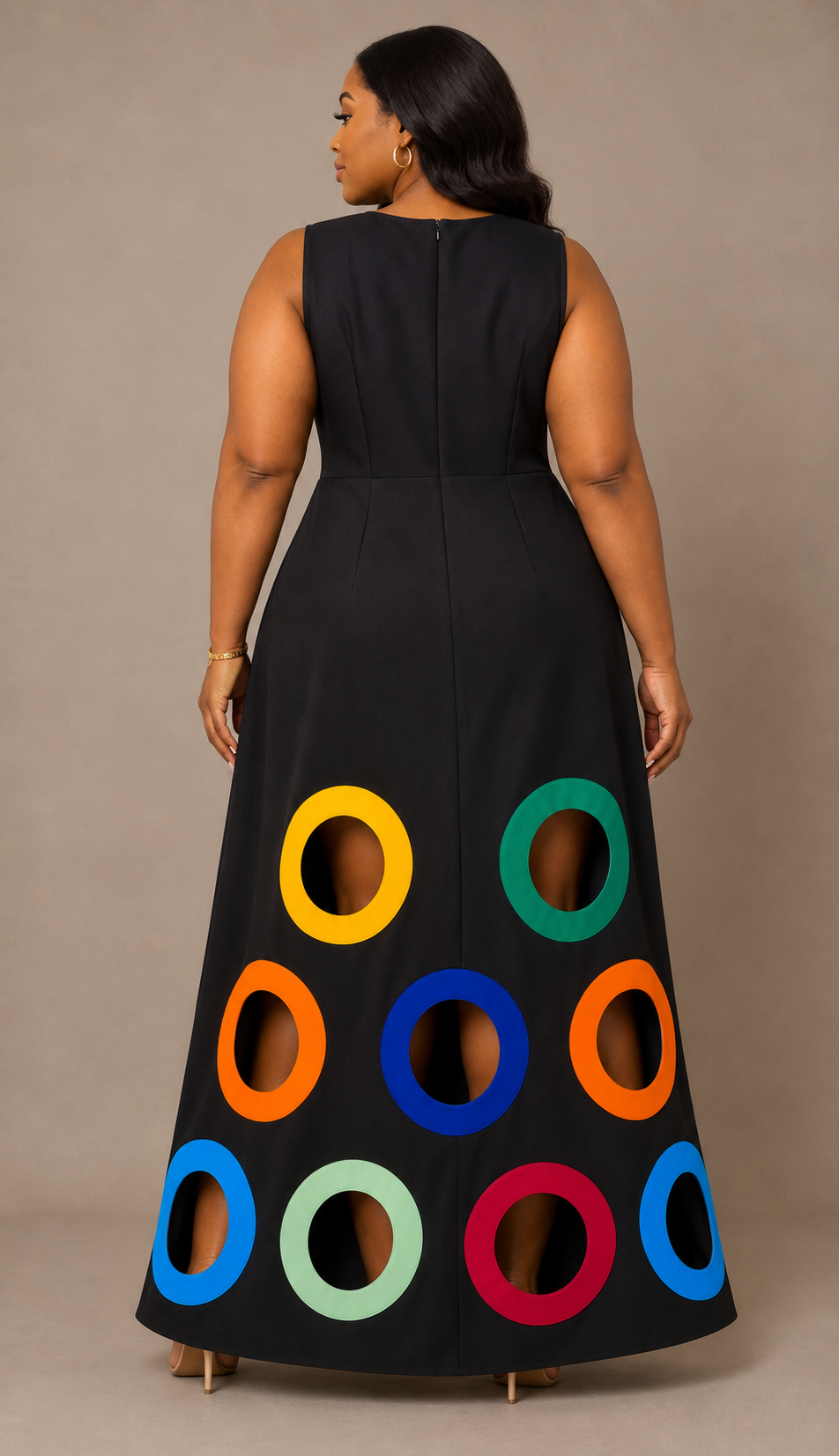 Back view of a plus size model wearing the For Her NYC Colorful Circles Cutout Dress in black with multicolor circle cutout details along the skirt, style S0176W.