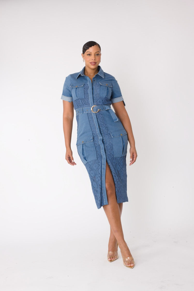 Denim lace trimmed midi dress walking forward pose highlighting tailored fit and slit hem.