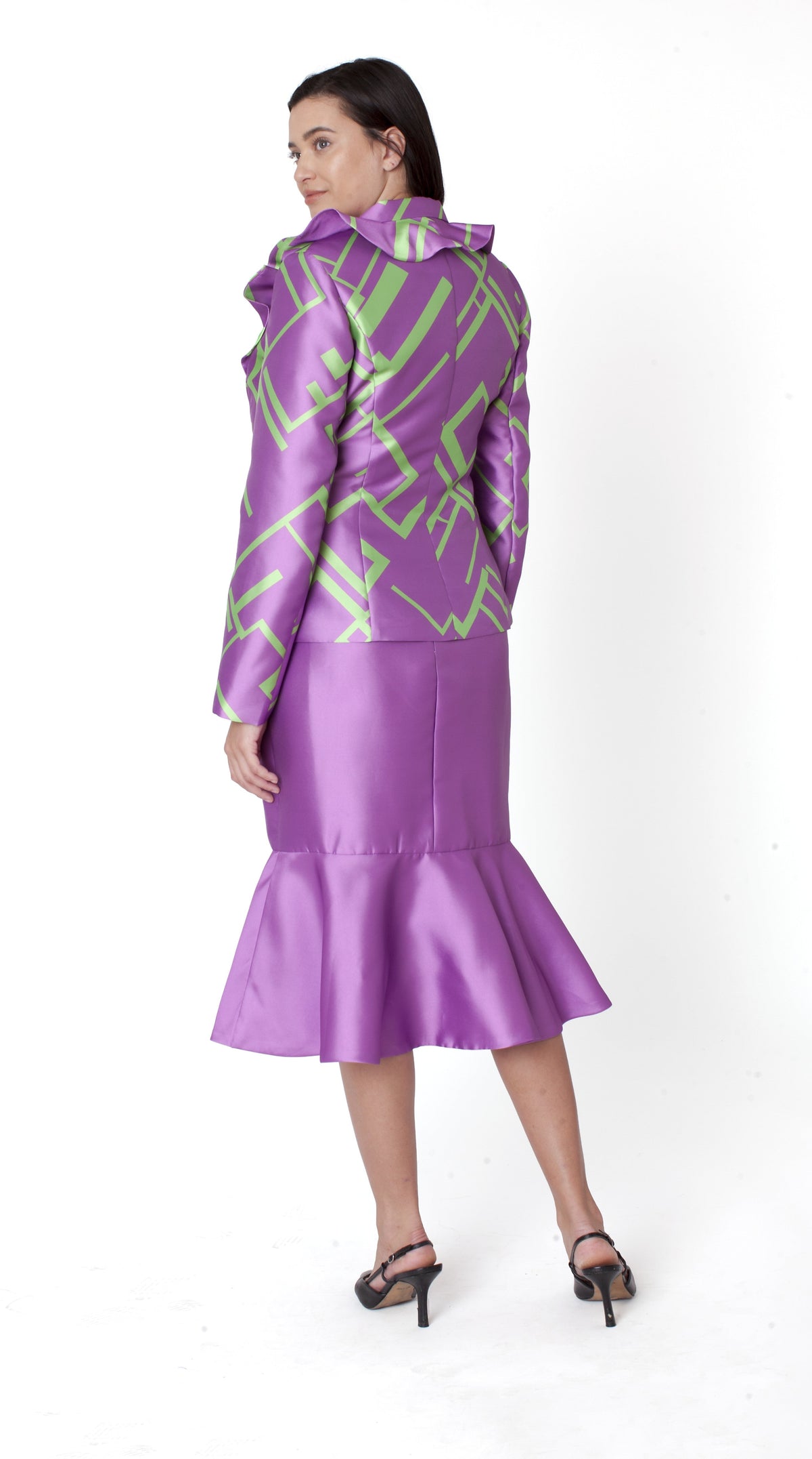 Woman wearing a purple multi geometric jacket and coordinating mermaid skirt shown in full-body view, highlighting elegant silhouette and movement — Tally Taylor