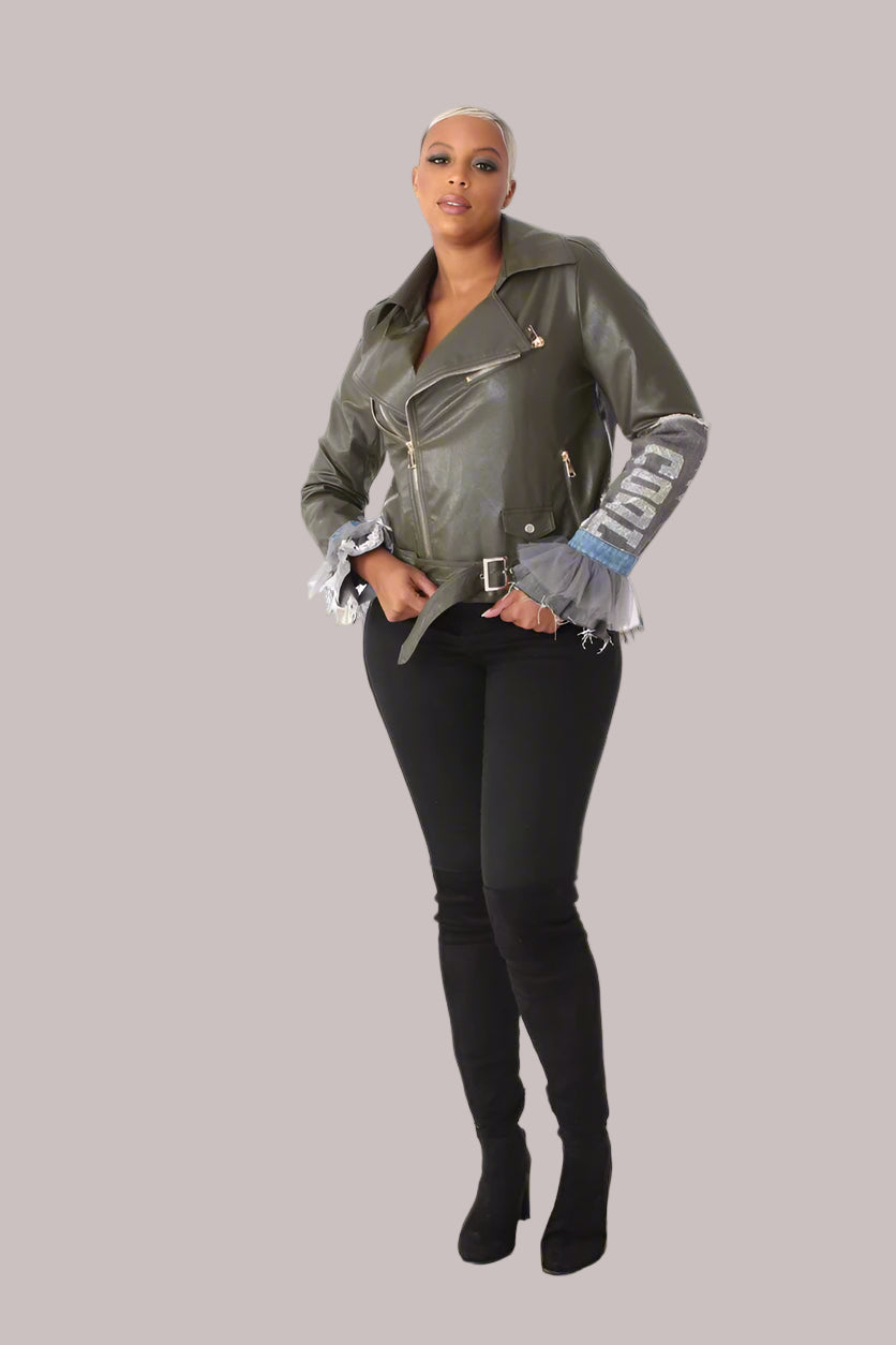 Front view of army green faux leather moto jacket with denim patchwork, rhinestone COOL sleeve detail and tulle cuffs.