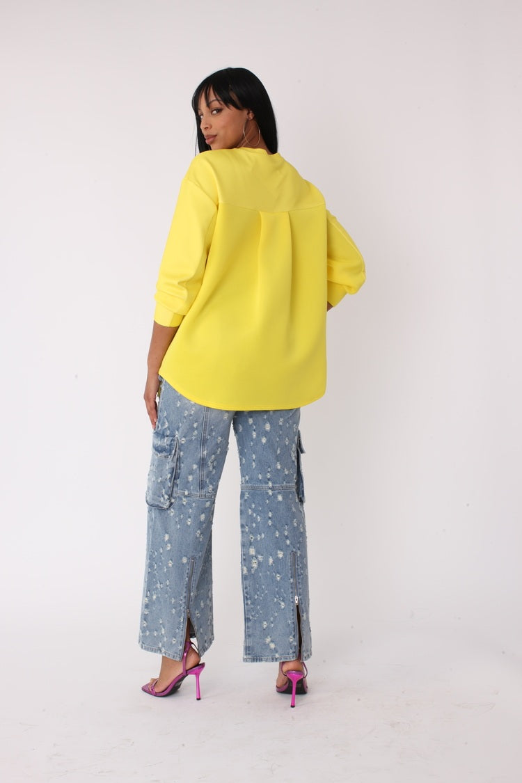 Back view of model wearing the yellow artistic portrait graphic long sleeve t shirt, showcasing relaxed fit, solid back design, and casual silhouette by For Her NYC