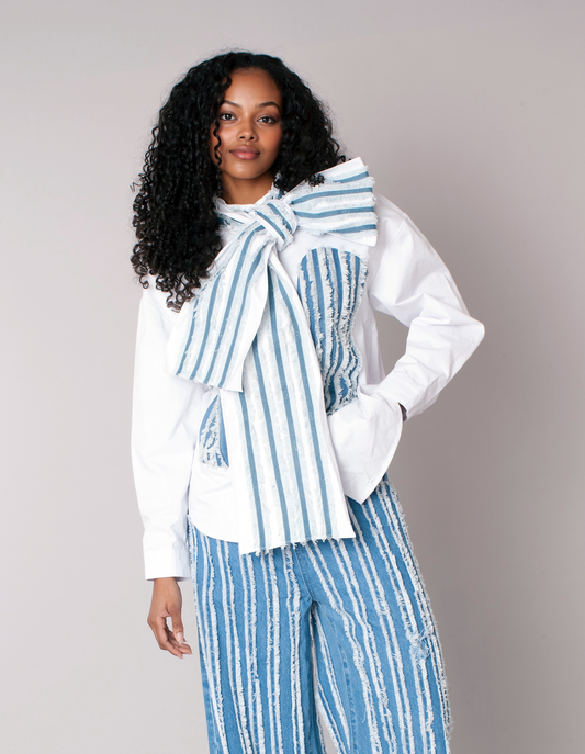 Front view of asymmetric stripe top with statement bow in white and denim For Her NYC