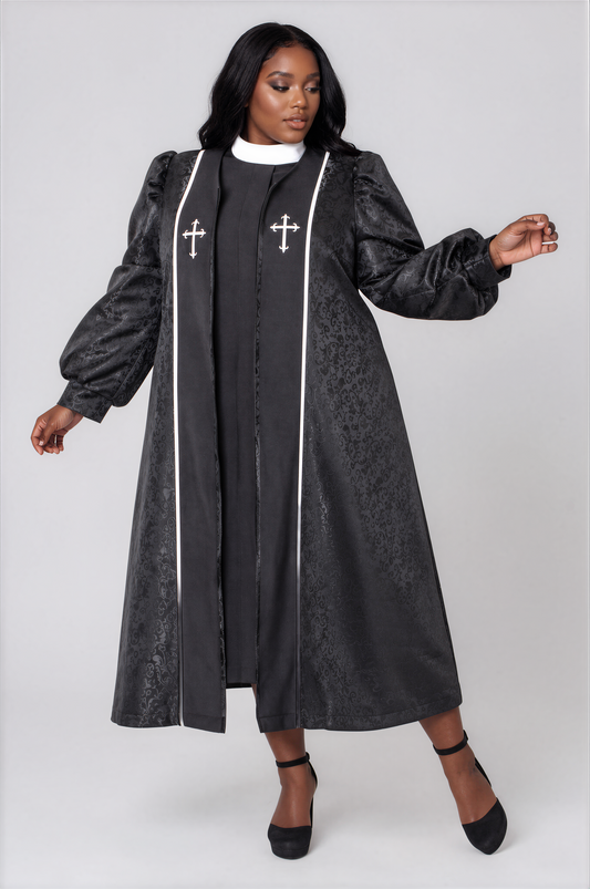 Plus size model wearing the Tally Taylor Two-Piece Brocade Clergy Robe in Black Multi, featuring a richly textured brocade outer robe with a coordinating inner dress, cross-inspired detailing, flowing silhouette, and elegant tailoring for worship services, pastoral anniversaries, ministry conferences, and installation ceremonies.