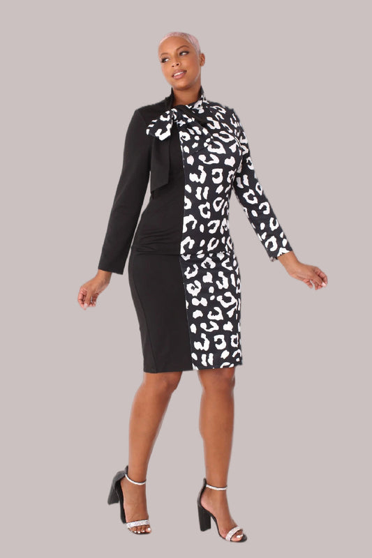 Model wearing black and white leopard print midi dress with bow collar, front-facing hero pose highlighting contrast panel design and puff sleeve detail by For Her NYC