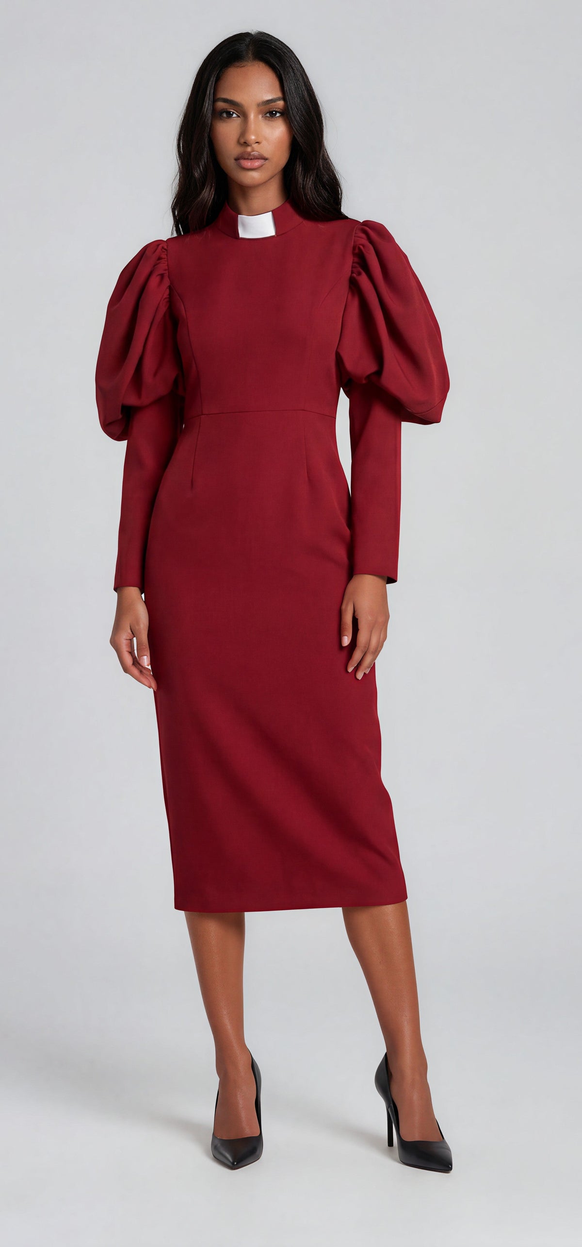 Burgundy clergy dress with puff sleeves and a classic collar shown in a front standing pose by Tally Taylor.