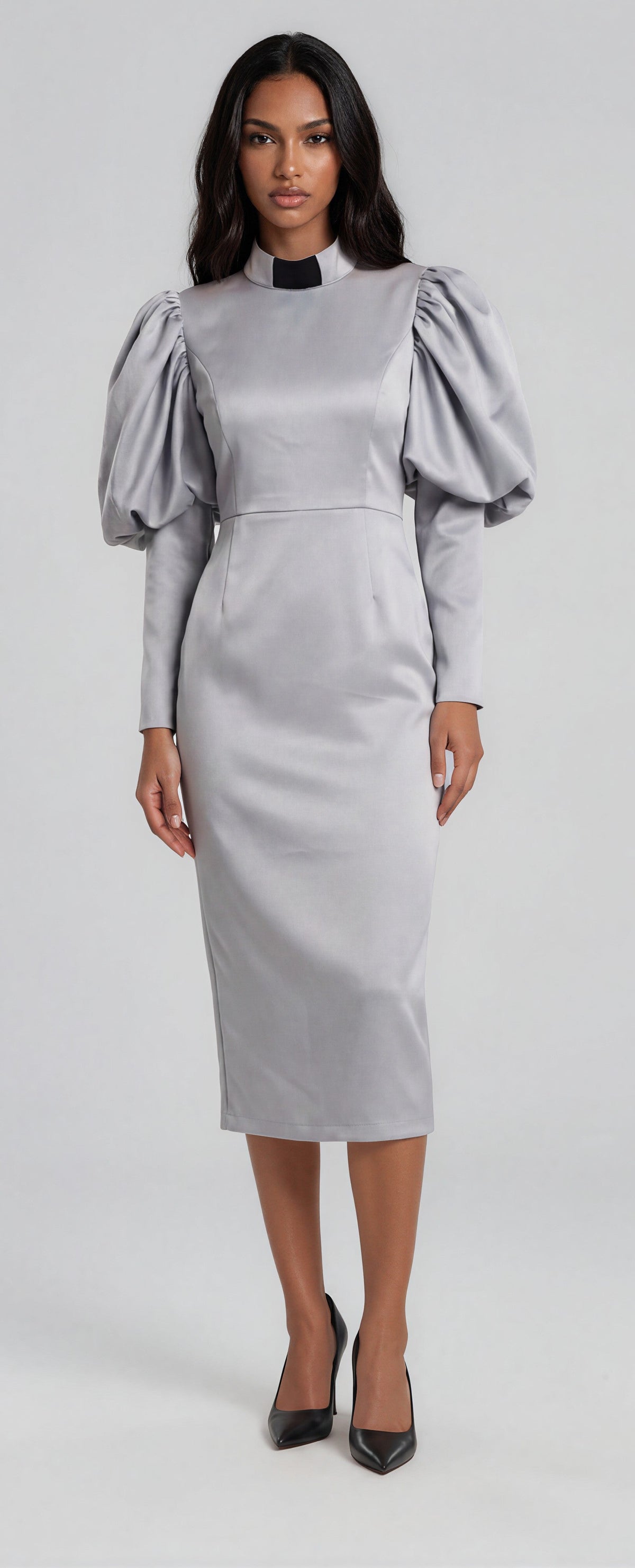 Silver clergy dress with puff sleeves and a classic collar shown in a front standing pose by Tally Taylor.