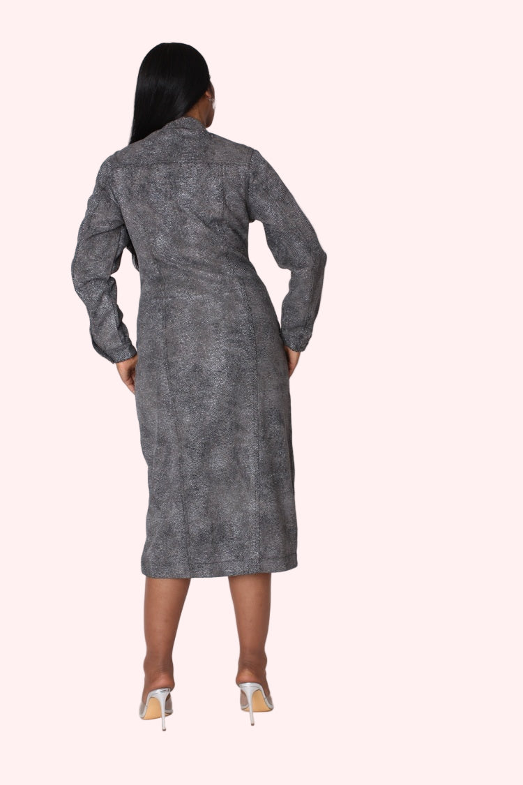 Back view of model wearing the black denim crystal embellished midi dress showing full crystal coverage and sleek midi length design by For Her NYC