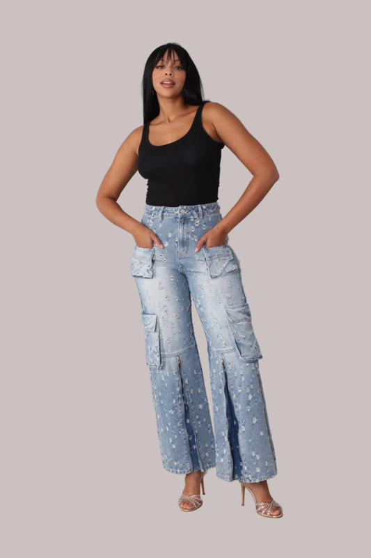 Distressed denim cargo jeans shown front view with hands on hips, wide leg fit, For Her NYC
