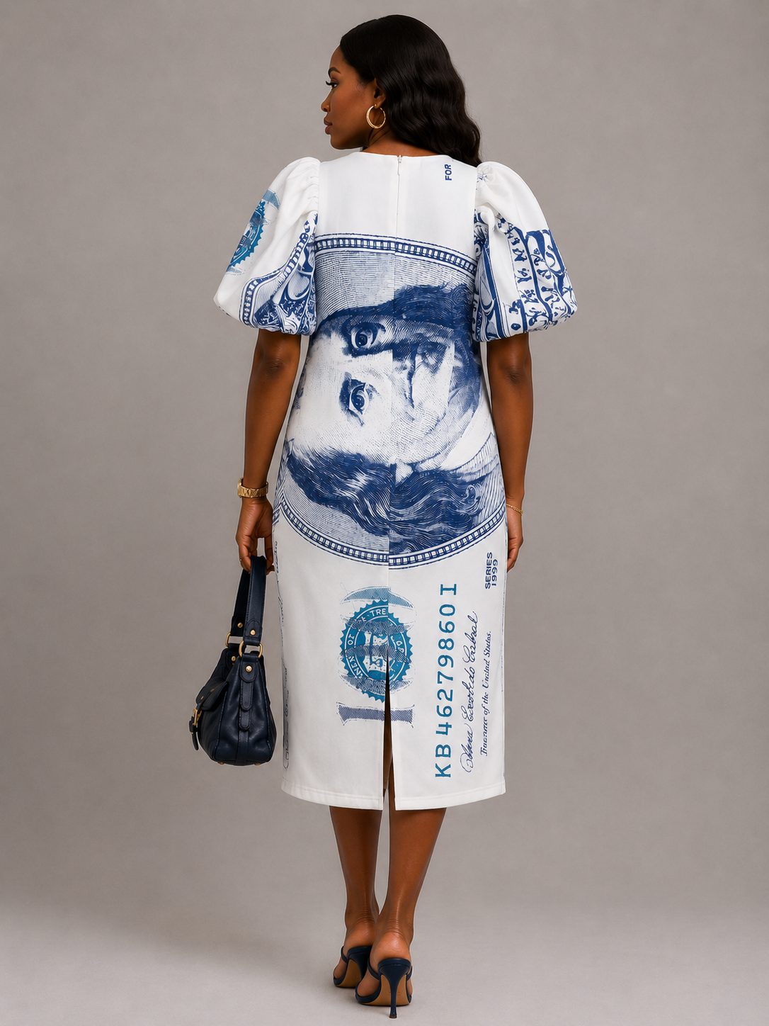 Model wearing dollar print scuba midi dress with bold puff sleeves in a trendy fashion look.